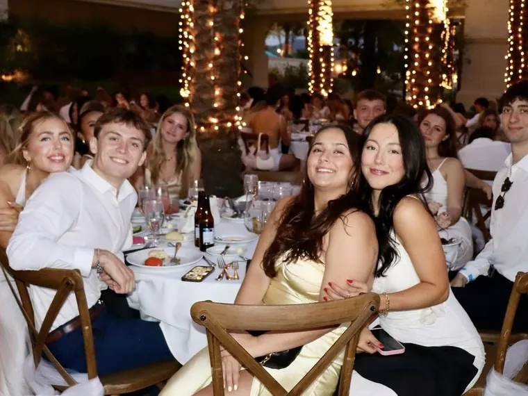 Sorority formal dinner under string lights